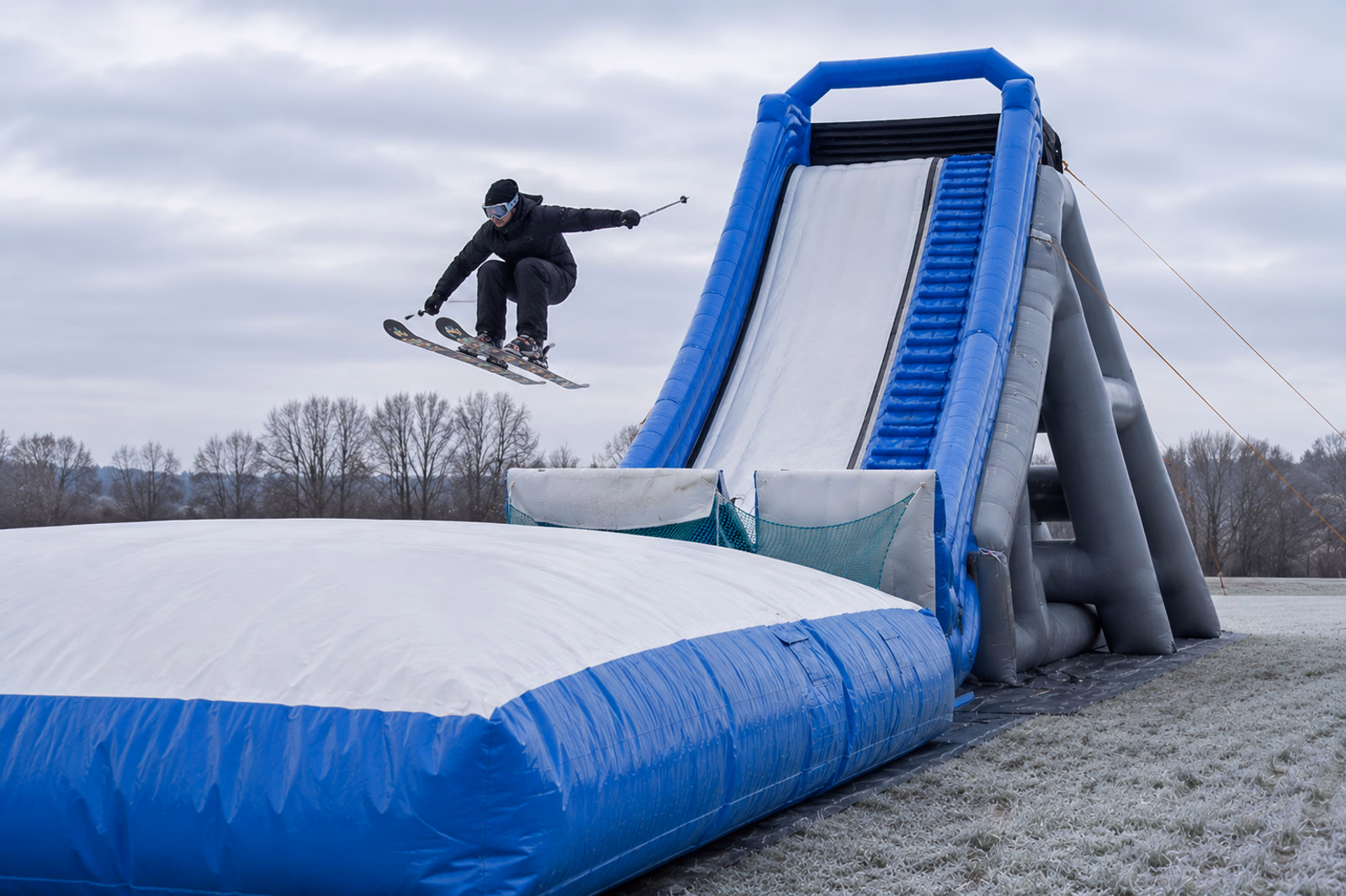 Skier launching off a Pearljump setup in winter